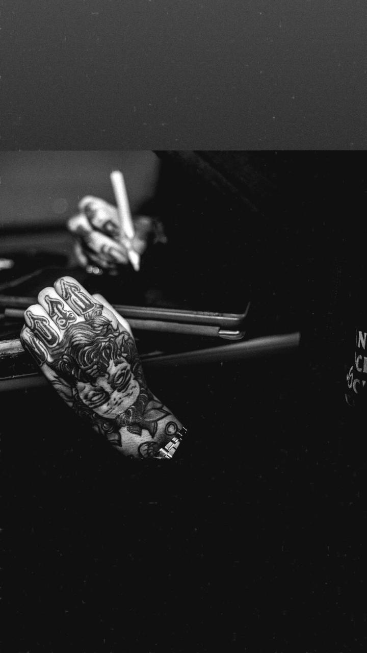 Hand tattoo with cherub design